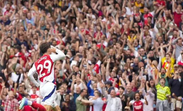 Arsenal's Kai Havertz celebrates after scoring his side's opening goal during the English Premier League soccer match between Arsenal and Brighton, at Emirates Stadium in London, Saturday, Aug. 31, 2024. (AP Photo/Alastair Grant)