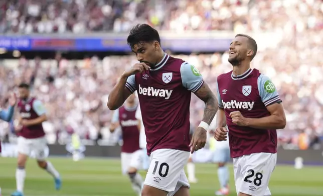 West Ham United's Lucas Paqueta celebrates after scoring his side's first goal during the British Premier League soccer match between West Ham and Aston Villa, at the London Stadium, Saturday Aug. 17, 2024. (Jordan Pettitt/PA via AP)