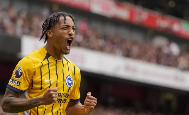 Brighton's Joao Pedro celebrates after scoring his side's opening goal during the English Premier League soccer match between Arsenal and Brighton, at Emirates Stadium in London, Saturday, Aug. 31, 2024. (AP Photo/Alastair Grant)