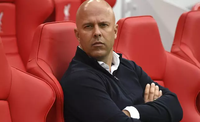 Liverpool's manager Arne Slot waits for the start of the English Premier League soccer match between Liverpool and Brentford at Anfield Stadium, Liverpool, England, Sunday, Aug. 25, 2024. (AP Photo/Rui Vieira)