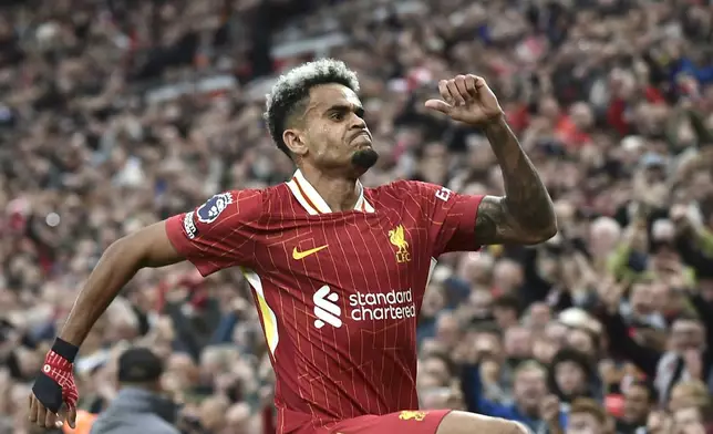 Liverpool's Luis Diaz celebrates after scoring his side's opening goal during the English Premier League soccer match between Liverpool and Brentford at Anfield Stadium, Liverpool, England, Sunday, Aug. 25, 2024. (AP Photo/Rui Vieira)