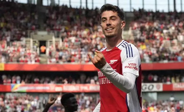 Arsenal's Kai Havertz celebrates after scoring his side's opening goal during the English Premier League soccer match between Arsenal and Wolverhampton Wanderers at Emirates Stadium in London, England, Saturday, Aug. 17, 2024. (AP Photo/Frank Augstein)