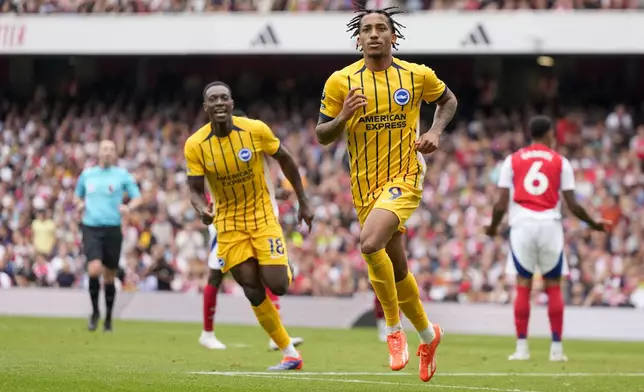 Brighton's Joao Pedro celebrates after scoring his side's opening goal during the English Premier League soccer match between Arsenal and Brighton, at Emirates Stadium in London, Saturday, Aug. 31, 2024. (AP Photo/Alastair Grant)