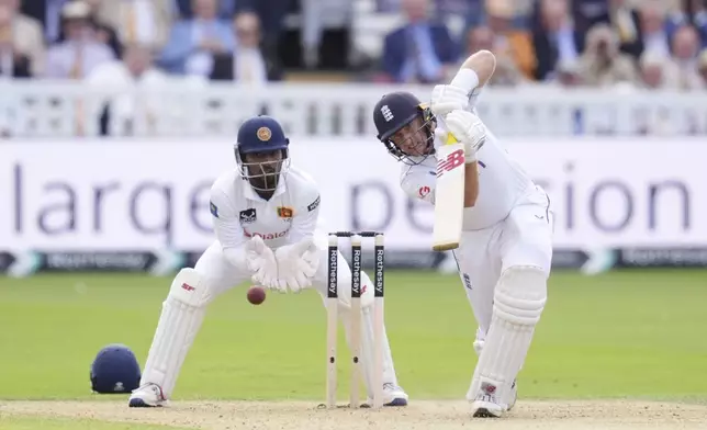 England's Joe Root bats during day one of the second Test cricket match between England and Sri Lanka, at Lord's, in London, Thursday, Aug. 29, 2024. (John Walton/PA via AP)