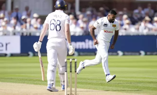 Sri Lanka's Lahiru Kumara celebrates taking the wicket of England's Dan Lawrence, during day one of the men's Test cricket match between England and Sri Lanka, at Lord's, in London, Thursday, Aug. 29, 2024. (John Walton/PA via AP)