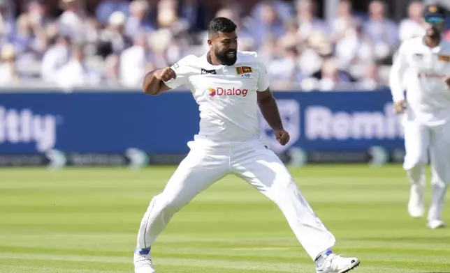 Sri Lanka's Lahiru Kumara celebrates taking the wicket of England's Dan Lawrence, during day one of the men's Test cricket match between England and Sri Lanka, at Lord's, in London, Thursday, Aug. 29, 2024. (John Walton/PA via AP)