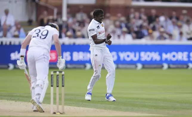 Sri Lanka's Milan Rathnayake celebrates the wicket of England's Jamie Smith during day one of the second Test cricket match between England and Sri Lanka, at Lord's, in London, Thursday, Aug. 29, 2024. (John Walton/PA via AP)