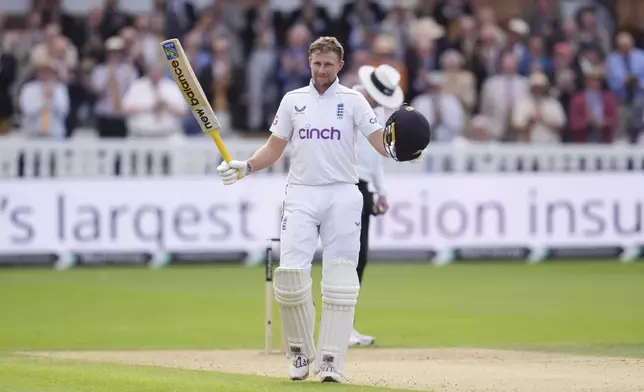 England's Joe Root celebrates a century during day one of the second Test cricket match between England and Sri Lanka, at Lord's, in London, Thursday, Aug. 29, 2024. (John Walton/PA via AP)