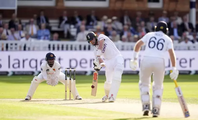 England's Gus Atkinson bats during day one of the second Test cricket match between England and Sri Lanka, at Lord's, in London, Thursday, Aug. 29, 2024. (John Walton/PA via AP)