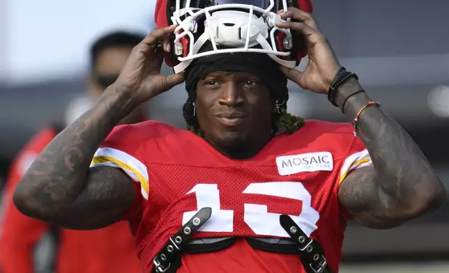 FILE - Kansas City Chiefs wide receiver Kadarius Toney walks to the field at the start of an NFL football training camp, July 27, 2024, in St. Joseph, Mo. (AP Photo/Reed Hoffmann, File)