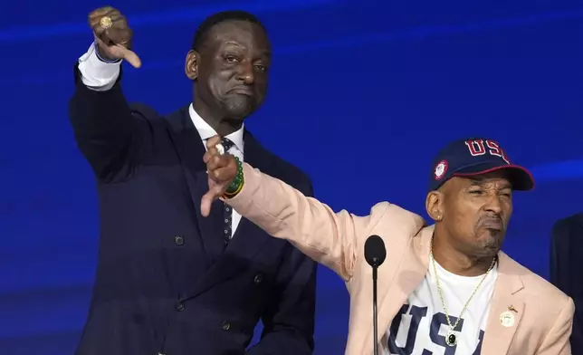 CORRECTS ID OF KOREY WISE - Yusef Salaam, left, and Korey Wise, members of the Exonerated Five, speak during the Democratic National Convention Thursday, Aug. 22, 2024, in Chicago. (AP Photo/J. Scott Applewhite)