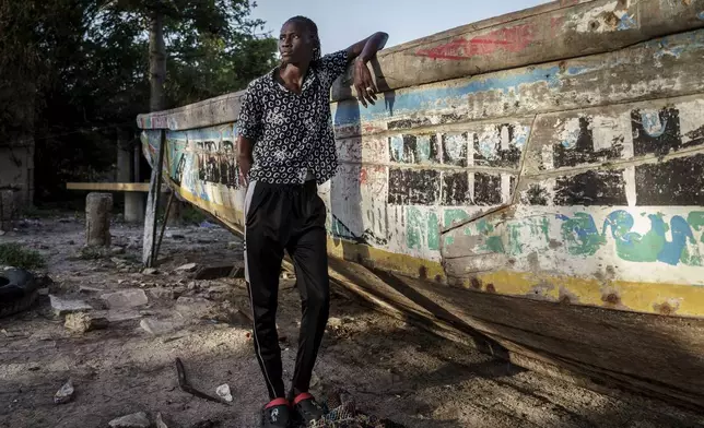 CORRECTS FAMILY NAME TO NDIAYE - Salamba Ndiaye, a 28-year-old who tried to migrate to Europe twice, poses for a photo at the beach in Thiaroye-Sur-Mer, Senegal, Friday, Aug. 23, 2024. Ndiaye is one of thousands of young Senegalese who try to flee poverty and the lack of job opportunities in the West African country each year to head to Spain. More than 22,300 people have landed on the Canary Islands from January to mid-August this year. (AP Photo/Annika Hammerschlag)