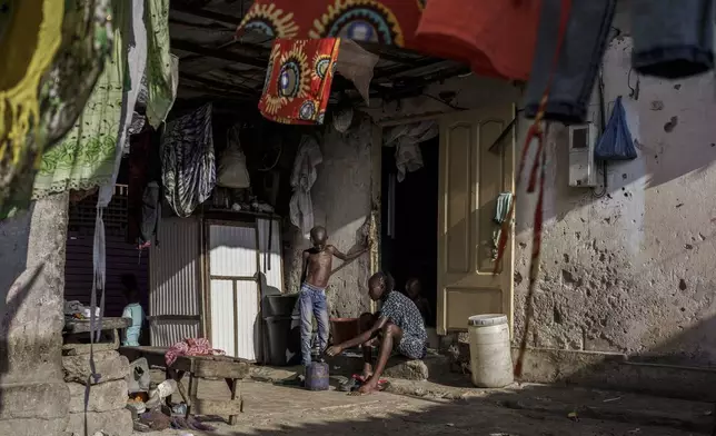 CORRECTS FAMILY NAME TO NDIAYE - Salamba Ndiaye, a 28-year-old who tried to migrate to Europe twice, is photographed at her family house in Thiaroye-Sur-Mer, Senegal, Friday, Aug. 23, 2024. Ndiaye is one of thousands of young Senegalese who try to flee poverty and the lack of job opportunities in the West African country each year to head to Spain. More than 22,300 people have landed on the Canary Islands from January to mid-August this year. (AP Photo/Annika Hammerschlag)