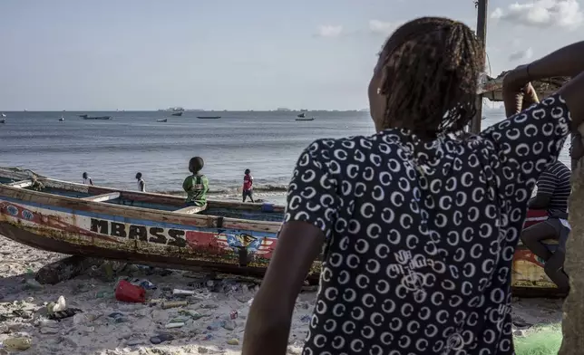 CORRECTS FAMILY NAME TO NDIAYE - Salamba Ndiaye, a 28-year-old who tried to migrate to Europe twice, is photographed at the beach in Thiaroye-Sur-Mer, Senegal, Friday, Aug. 23, 2024. Ndiaye is one of thousands of young Senegalese who try to flee poverty and the lack of job opportunities in the West African country each year to head to Spain. More than 22,300 people have landed on the Canary Islands from January to mid-August this year, (AP Photo/Annika Hammerschlag)