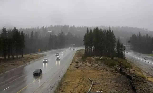 Motorists make their way along a rain-soaked Interstate 80 Saturday, Aug. 24, 2024, in Donner Summit, Calif. (AP Photo/Brooke Hess-Homeier)