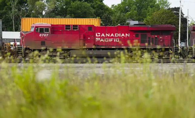 Trains sit idle at a Canadian Pacific Kansas City (CPKC) rail yard in Smiths Falls, Ont., on Thursday, Aug. 22, 2024. (Sean Kilpatrick /The Canadian Press via AP)