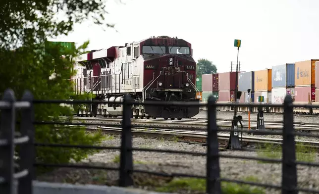 Trains sit idle at a Canadian Pacific Kansas City (CPKC) rail yard in Smiths Falls, Ont., on Thursday, Aug. 22, 2024. (Sean Kilpatrick /The Canadian Press via AP)