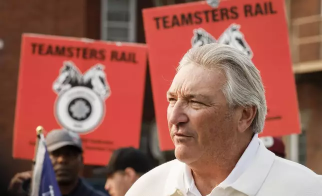 Francois Laporte, National President, Teamsters Canada, speaks to media as picketing rail workers gather at the CPKC headquarters in Calgary, Alta., Friday, Aug. 23, 2024.(Jeff McIntosh /The Canadian Press via AP)