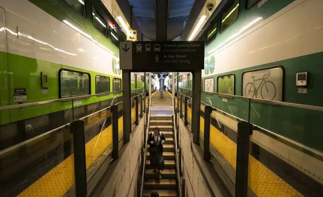 Commuters arrive at Union Station on a GO Train as a national rail shutdown causes delays in Toronto, Thursday, Aug. 22, 2024. (Paige Taylor White /The Canadian Press via AP)