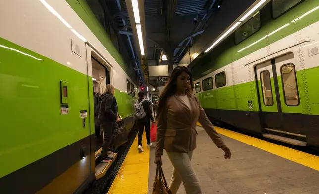 Commuters arrive at Union Station on a GO Train as a national rail shutdown causes delays in Toronto, Thursday, Aug. 22, 2024. (Paige Taylor White /The Canadian Press via AP)