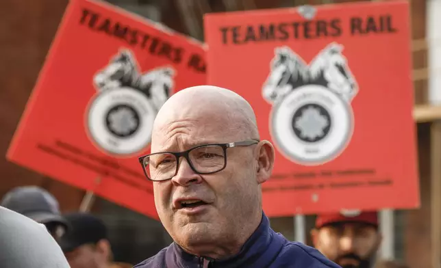 Sean O'Brien, General President, International Brotherhood of Teamsters, speaks to media as picketing rail workers gather at the CPKC headquarters in Calgary, Alta., Friday, Aug. 23, 2024.(Jeff McIntosh /The Canadian Press via AP)