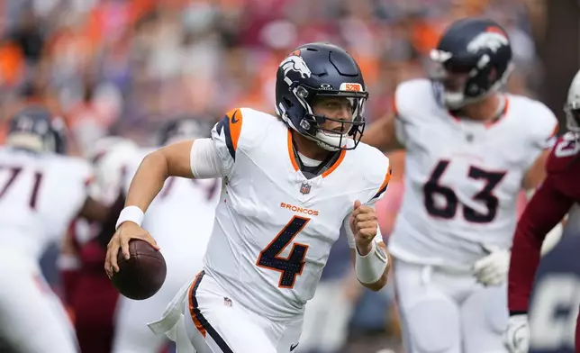 Denver Broncos quarterback Zach Wilson runs with the ball against the Arizona Cardinals during the first half of a preseason NFL football game Sunday, Aug. 25, 2024, in Denver. (AP Photo/Jack Dempsey)