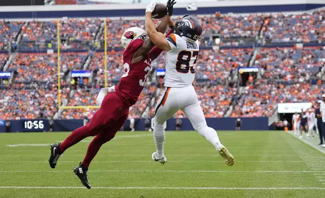 Arizona Cardinals cornerback Jaden Davis, left, breaks up a pass intended for Denver Broncos wide receiver Michael Bandy, right, during the secondd half of a preseason NFL football game Sunday, Aug. 25, 2024, in Denver. (AP Photo/Jack Dempsey)