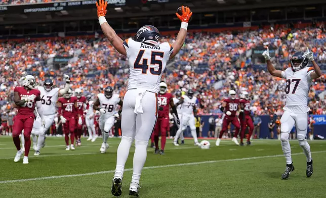 Denver Broncos tight end Nate Adkins (45) celebrates his touchdown against the Arizona Cardinals with Broncos wide receiver David Sills V (87) during the first half of a preseason NFL football game Sunday, Aug. 25, 2024, in Denver. (AP Photo/Jack Dempsey)