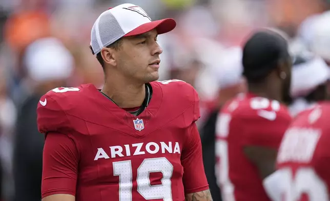 Arizona Cardinals quarterback Desmond Ridder pauses on the sideline during the second half of a preseason NFL football game against the Denver Broncos, Sunday, Aug. 25, 2024, in Denver. (AP Photo/David Zalubowski)