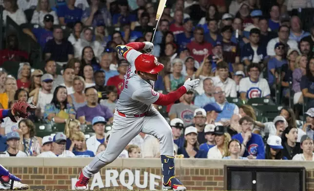 St. Louis Cardinals' Nolan Arenado hits a one-run single against the Chicago Cubs during the seventh inning of a baseball game Thursday, Augu. 1, 2024, in Chicago. (AP Photo/David Banks)