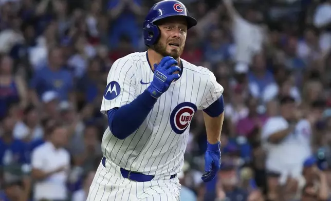 Chicago Cubs' Michael Busch runs after hitting a one-run single during the fifth inning of a baseball game against the St. Louis Cardinals in Chicago, Sunday, Aug. 4, 2024. (AP Photo/Nam Y. Huh)