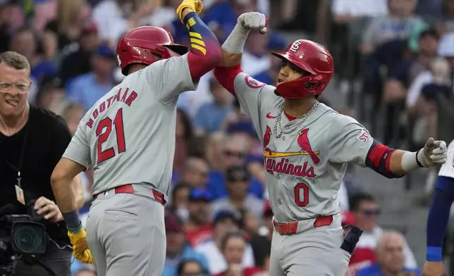 St. Louis Cardinals' Masyn Winn, right, celebrates with Lars Nootbaar after hitting a two-run home run during the third inning of a baseball game against the Chicago Cubs in Chicago, Sunday, Aug. 4, 2024. (AP Photo/Nam Y. Huh)