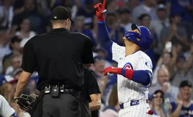 Chicago Cubs' Miguel Amaya, right, celebrates after hitting a solo home run during the sixth inning of a baseball game against the St. Louis Cardinals in Chicago, Sunday, Aug. 4, 2024. (AP Photo/Nam Y. Huh)