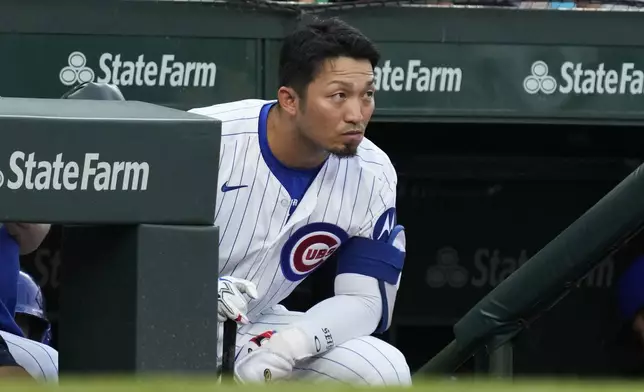 Chicago Cubs' Seiya Suzuki, of Japan, looks at St. Louis Cardinals starting pitcher Miles Mikolas during the first inning of a baseball game in Chicago, Sunday, Aug. 4, 2024. (AP Photo/Nam Y. Huh)