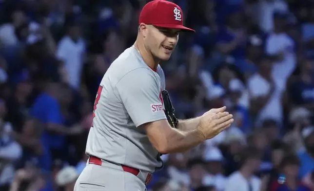 St. Louis Cardinals relief pitcher John King reacts after Chicago Cubs' Mike Tauchman hit a solo home run during the sixth inning of a baseball game in Chicago, Sunday, Aug. 4, 2024. (AP Photo/Nam Y. Huh)