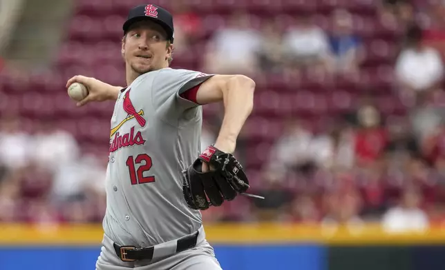 St. Louis Cardinals' Erick Fedde delivers a pitch during the first inning of a baseball game against the Cincinnati Reds, Tuesday, Aug. 13, 2024, in Cincinnati. (AP Photo/Kareem Elgazzar)