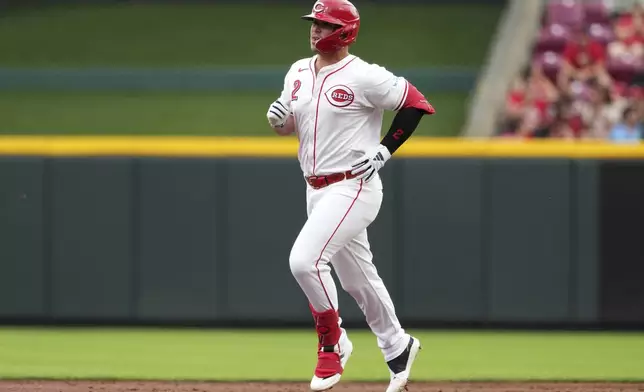 Cincinnati Reds Ty France rounds the bases after hitting a solo home run during the second inning of a baseball game against the St. Louis Cardinals, Tuesday, Aug. 13, 2024, in Cincinnati. (AP Photo/Kareem Elgazzar)