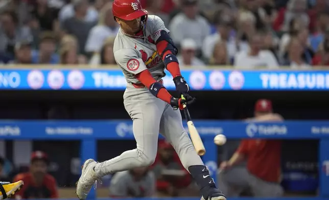 St. Louis Cardinals' Masyn Winn hits an RBI single during the third inning of a baseball game against the Minnesota Twins, Friday, Aug. 23, 2024, in Minneapolis. (AP Photo/Abbie Parr)