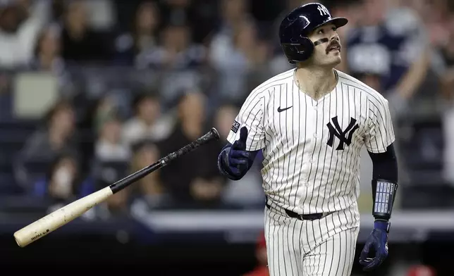 New York Yankees' Austin Wells watches a two-run home run during the eighth inning of a baseball game against the St. Louis Cardinals, Friday, Aug. 30, 2024, in New York. The Yankees won 6-3. (AP Photo/Adam Hunger)