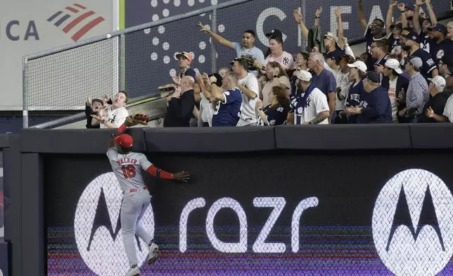 St. Louis Cardinals right fielder Jordan Walker (18) attempts to make a play on a two-run home run hit by New York Yankees' Austin Wells during the third inning of a baseball game, Friday, Aug. 30, 2024, in New York. (AP Photo/Adam Hunger)