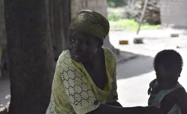 Josephine Noubarangal, a mother of six children, who suffered from violence is photographed outside her house in Binmar, Chad, Friday, July 19, 2024. (AP Photo/Robert Bociaga)