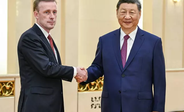 In this photo released by Xinhua News Agency, Chinese President Xi Jinping, right, meets with White House national security adviser Jake Sullivan at the Great Hall of the People in Beijing, capital of China, Thursday, Aug. 29, 2024. (Li Xueren/Xinhua via AP)