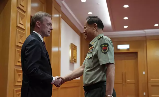 Zhang Youxia, vice chairman of the CPC Central Military Commission, right, shakes hands with White House national security adviser Jake Sullivan before a meeting at the Bayi building in Beijing, Thursday, Aug. 29, 2024. (AP Photo/Ng Han Guan, Pool)