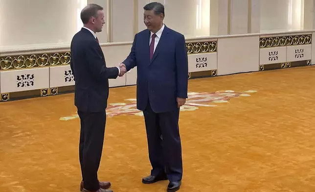 White House national security adviser Jake Sullivan, left, and Chinese President Xi Jinping shake hands at the Great Hall of the People in Beijing, China Thursday, Aug. 29, 2024. (Trevor Hunnicutt/Pool Photo via AP)