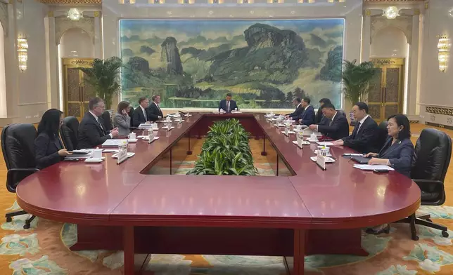 White House national security adviser Jake Sullivan, rear left, accompanied by U.S. Ambassador to China Nicholas Burns meets Chinese President Xi Jinping, center, accompanied by China's Foreign Minister Wang Yi at the Great Hall of the People in Beijing, China Thursday, Aug. 29, 2024. (Trevor Hunnicutt/Pool Photo via AP)