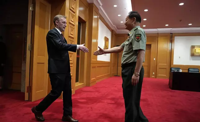 Zhang Youxia, vice chairman of the CPC Central Military Commission, right, shakes hands with White House national security adviser Jake Sullivan before a meeting at the Bayi building in Beijing, Thursday, Aug. 29, 2024. (AP Photo/Ng Han Guan, Pool)