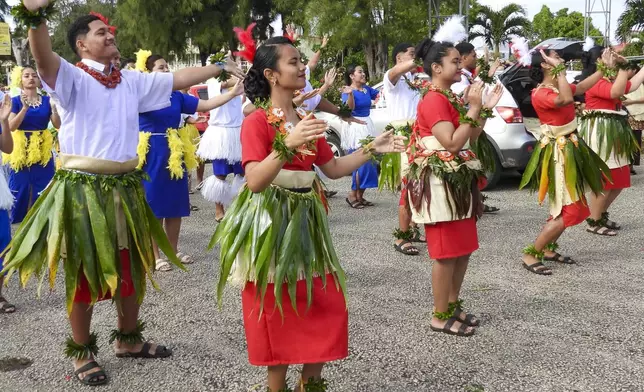 High school students march for climate justice as Pacific leaders meet in Nuku'alofa, Tonga, Tuesday, Aug. 27, 2024. (AP Photo/Charlotte Graham-McLay)