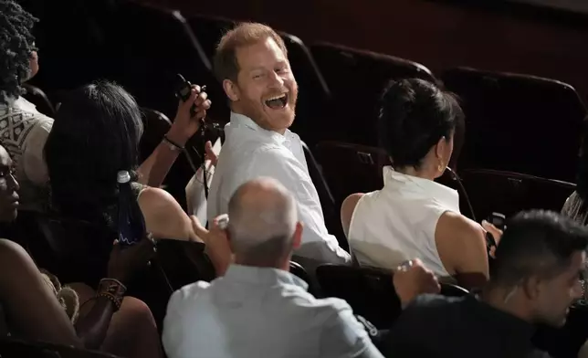 Prince Harry smiles at a forum on Afro women and power in Cali, Colombia, Sunday, Aug. 18, 2024. (AP Photo/Ivan Valencia)