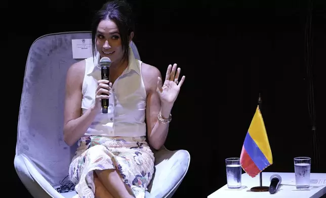 Meghan Markle, Prince Harry's wife, speaks during a forum on Afro women and power in Cali, Colombia, Sunday, Aug. 18, 2024. (AP Photo/Ivan Valencia)