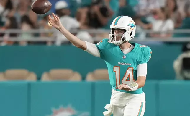 Miami Dolphins quarterback Mike White (14) throws during the second half of a preseason NFL football game against the Washington Commanders, Saturday, Aug. 17, 2024, in Miami Gardens, Fla. (AP Photo/Wilfredo Lee)